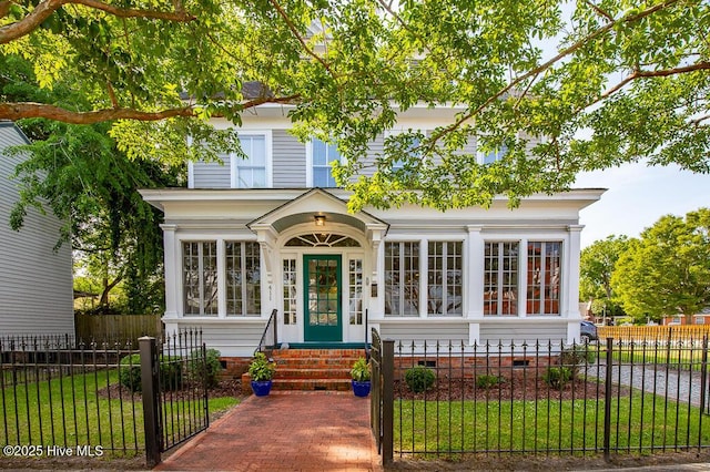 411 Queen St, New Bern, NC 28560 - view of front of house featuring crawl space, a fenced front yard, and a front yard