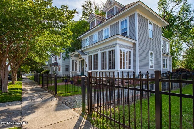 411 Queen St, New Bern, NC 28560 - american foursquare style home featuring a fenced front yard, a gate, and a front yard