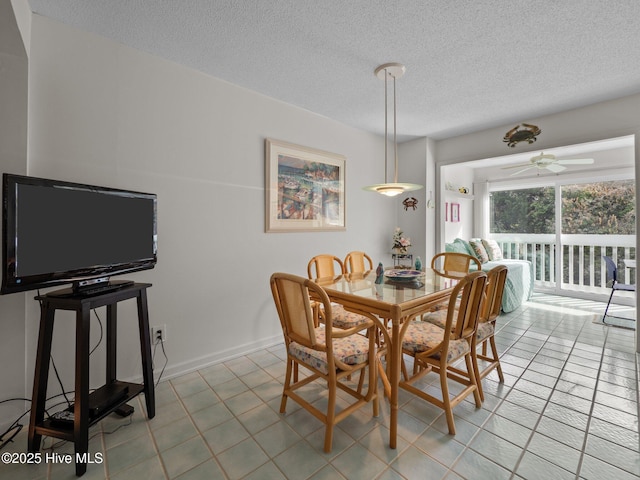 dining area featuring light tile patterned flooring, a textured ceiling, and ceiling fan