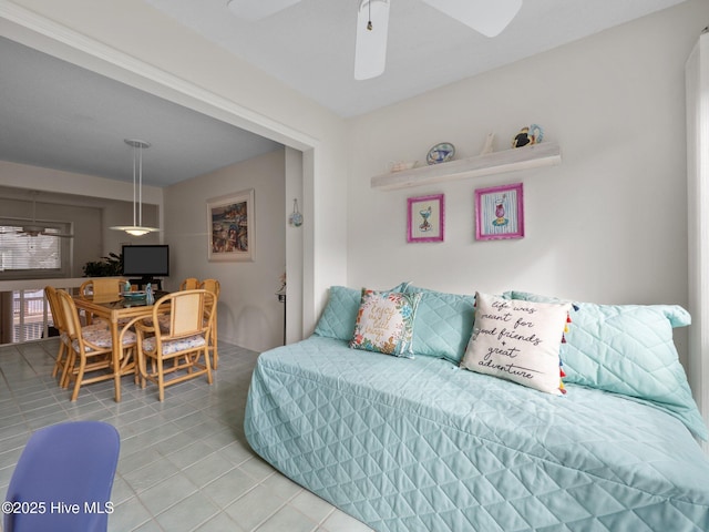 bedroom featuring light tile patterned flooring and ceiling fan