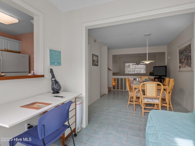 dining room featuring light tile patterned floors and visible vents
