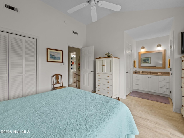bedroom featuring visible vents, a ceiling fan, high vaulted ceiling, and a closet