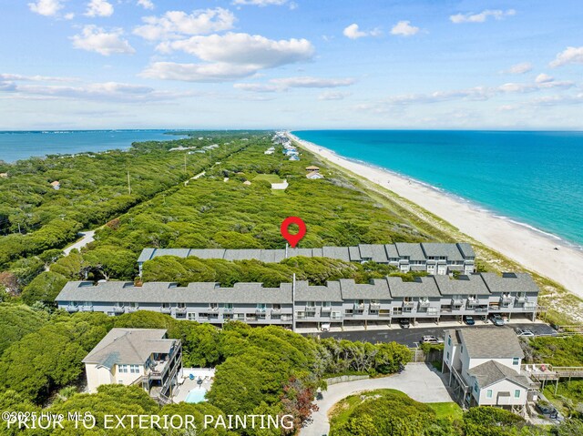 bird's eye view featuring a beach view and a water view