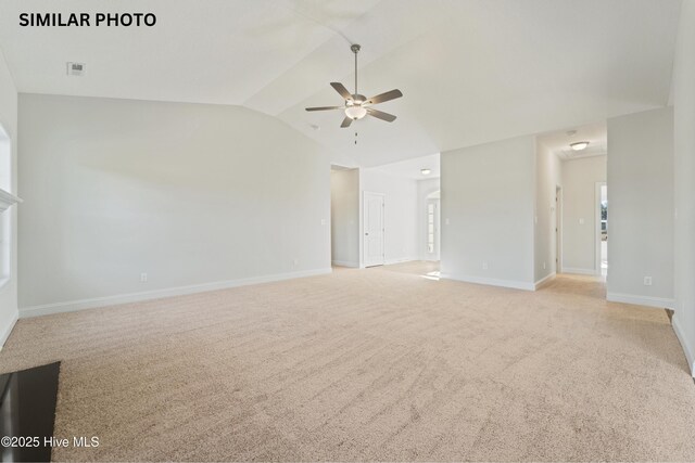 608 Indigo Johnston Dr, Jacksonville, NC 28546 - unfurnished living room with visible vents, baseboards, a ceiling fan, light colored carpet, and lofted ceiling