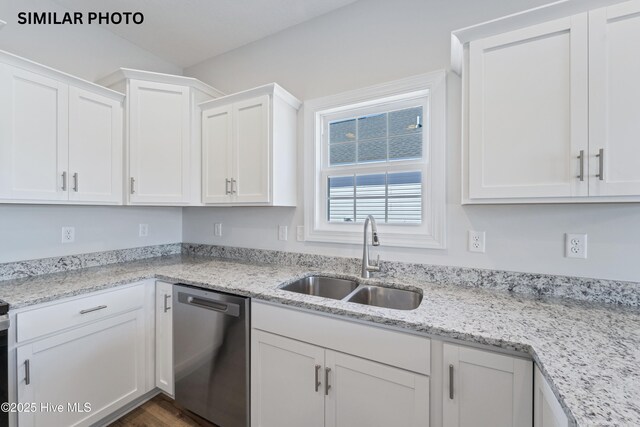 608 Indigo Johnston Dr, Jacksonville, NC 28546 - kitchen featuring a sink, white cabinetry, dishwasher, and light stone countertops