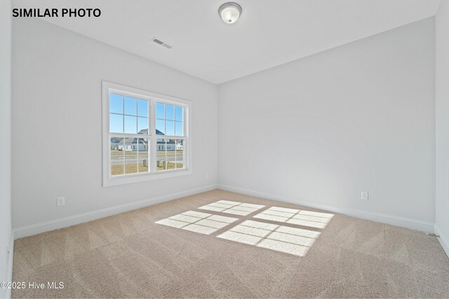 608 Indigo Johnston Dr, Jacksonville, NC 28546 - spare room featuring visible vents, baseboards, and carpet