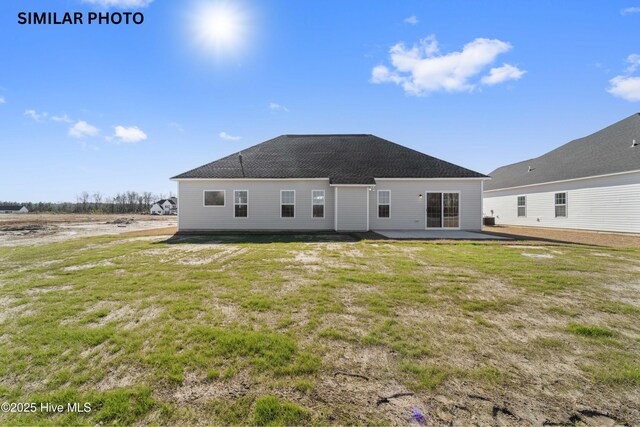 608 Indigo Johnston Dr, Jacksonville, NC 28546 - rear view of property with a yard, a patio area, and a shingled roof