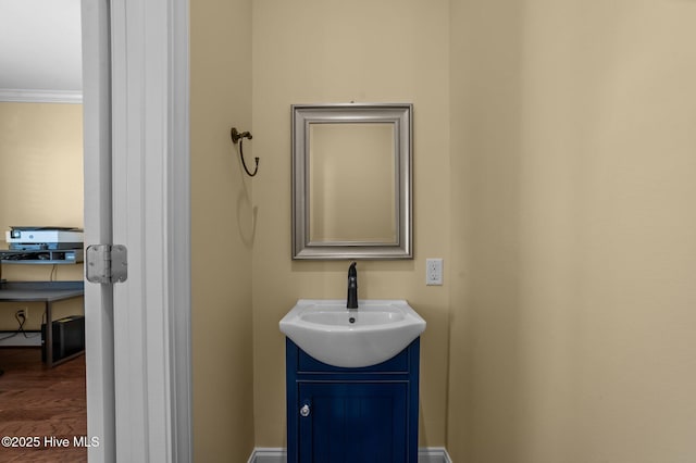 281 Whichard Ln, Chocowinity, NC 27817 - bathroom with vanity, ornamental molding, and wood finished floors