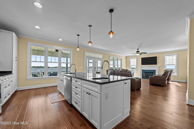 281 Whichard Ln, Chocowinity, NC 27817 - kitchen with dark countertops, dishwasher, a sink, ornamental molding, and a kitchen island with sink