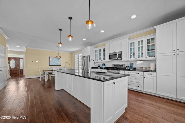 281 Whichard Ln, Chocowinity, NC 27817 - kitchen featuring stainless steel appliances, crown molding, dark countertops, a sink, and an island with sink