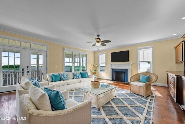 281 Whichard Ln, Chocowinity, NC 27817 - living room with ornamental molding, dark wood-style flooring, ceiling fan, french doors, and a fireplace with flush hearth