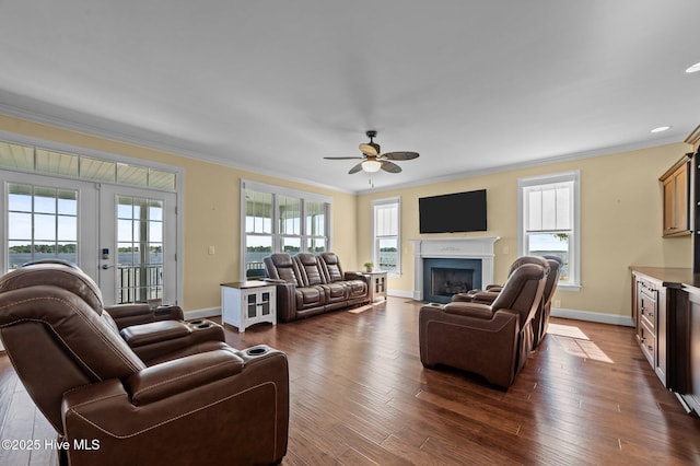 281 Whichard Ln, Chocowinity, NC 27817 - living room featuring crown molding, a ceiling fan, baseboards, a fireplace with flush hearth, and french doors