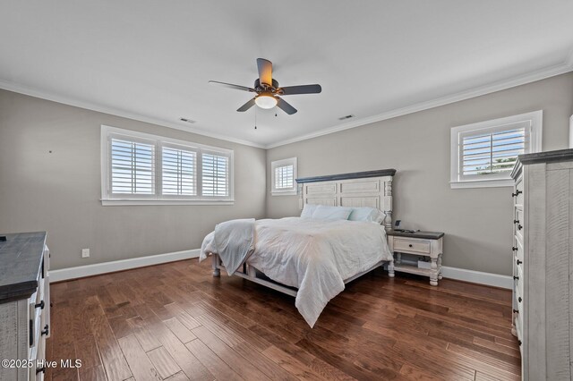 281 Whichard Ln, Chocowinity, NC 27817 - bedroom featuring multiple windows, crown molding, dark wood finished floors, and baseboards