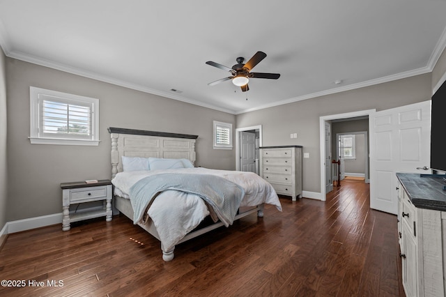 281 Whichard Ln, Chocowinity, NC 27817 - bedroom featuring multiple windows, dark wood-style floors, baseboards, and crown molding