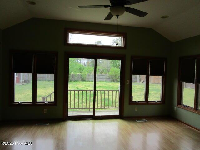 unfurnished sunroom featuring visible vents