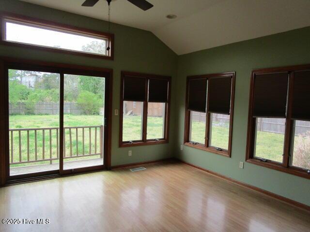 unfurnished sunroom featuring visible vents
