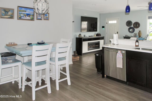 314 Nugget Trl, Elizabeth City, NC 27909 - kitchen featuring stainless steel dishwasher, a sink, dark wood-type flooring, and light countertops