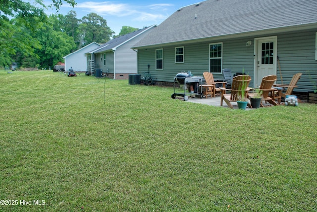 314 Nugget Trl, Elizabeth City, NC 27909 - back of property featuring a patio, a yard, and a shingled roof