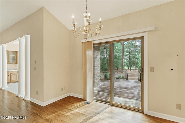 17 Windsong Pl, Whispering Pines, NC 28327 - unfurnished dining area featuring wood finished floors and a chandelier