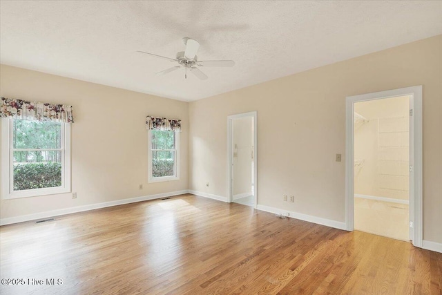 17 Windsong Pl, Whispering Pines, NC 28327 - spare room with healthy amount of natural light, ceiling fan, light wood finished floors, and a textured ceiling