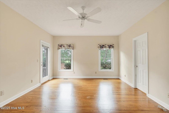 17 Windsong Pl, Whispering Pines, NC 28327 - unfurnished room featuring healthy amount of natural light, wood finished floors, a textured ceiling, and ceiling fan