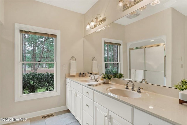 17 Windsong Pl, Whispering Pines, NC 28327 - full bath with double vanity and a shower stall