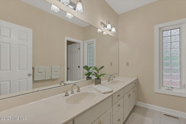 17 Windsong Pl, Whispering Pines, NC 28327 - full bathroom featuring double vanity and tile patterned flooring