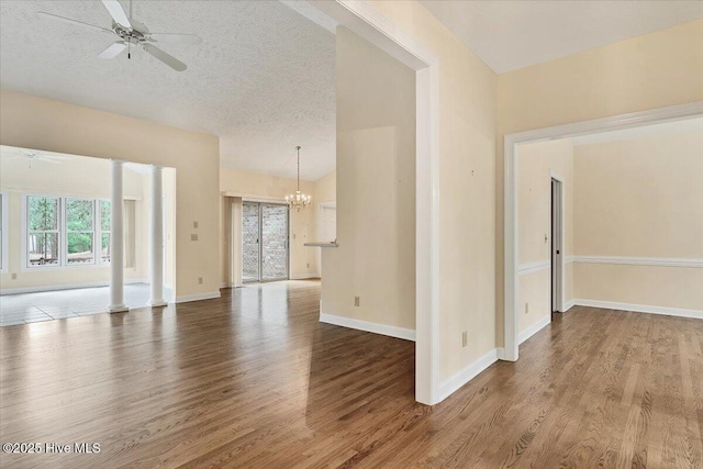 17 Windsong Pl, Whispering Pines, NC 28327 - unfurnished room featuring a ceiling fan, wood finished floors, a chandelier, and a textured ceiling