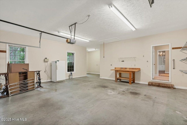 17 Windsong Pl, Whispering Pines, NC 28327 - garage featuring a garage door opener and a workshop area