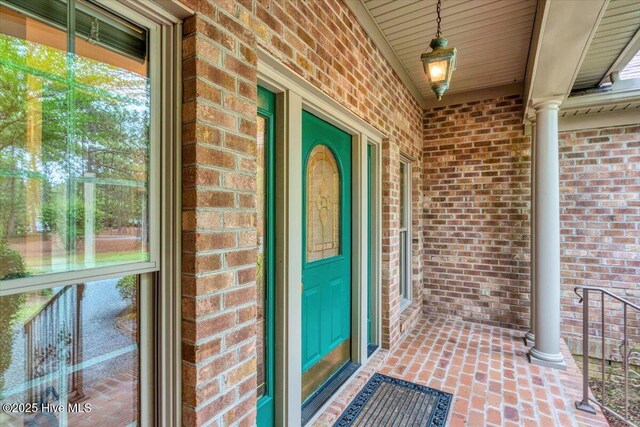 17 Windsong Pl, Whispering Pines, NC 28327 - view of exterior entry with brick siding