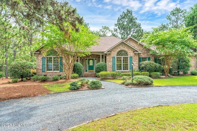 17 Windsong Pl, Whispering Pines, NC 28327 - single story home featuring brick siding, crawl space, and a front lawn