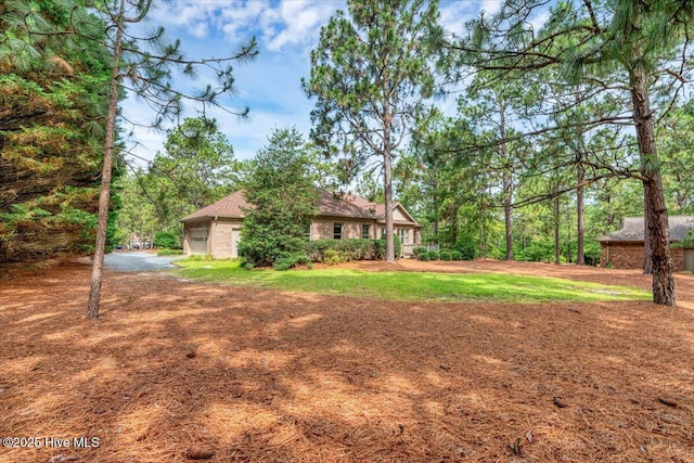 17 Windsong Pl, Whispering Pines, NC 28327 - view of yard featuring dirt driveway