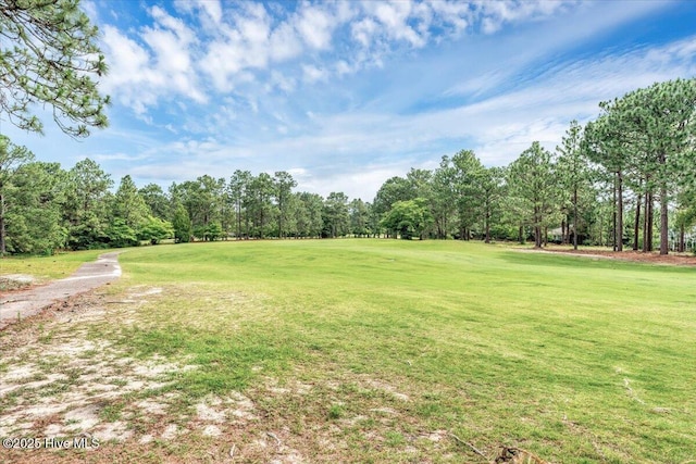 17 Windsong Pl, Whispering Pines, NC 28327 - view of green lawn with view of wooded area and view of golf course