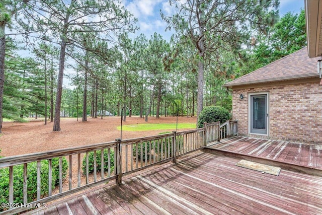 17 Windsong Pl, Whispering Pines, NC 28327 - wooden terrace with view of wooded area