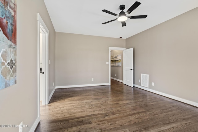6445 Red Oak Rd, Battleboro, NC 27809 - unfurnished bedroom with dark wood-style flooring and a ceiling fan