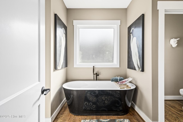 6445 Red Oak Rd, Battleboro, NC 27809 - bathroom featuring wood finished floors and a soaking tub