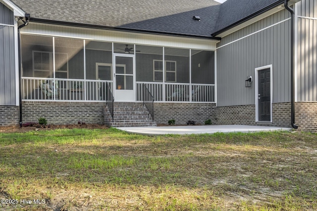 6445 Red Oak Rd, Battleboro, NC 27809 - back of house with a shingled roof, brick siding, a sunroom, and ceiling fan
