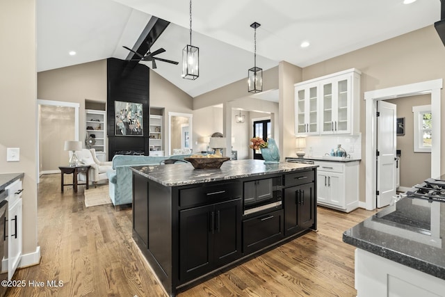 6445 Red Oak Rd, Battleboro, NC 27809 - kitchen with dark cabinets, a ceiling fan, white cabinetry, light wood finished floors, and high vaulted ceiling