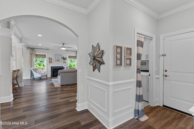 57 N Passerine Path, Hampstead, NC 28443 - foyer featuring arched walkways, a ceiling fan, dark wood-style flooring, crown molding, and recessed lighting