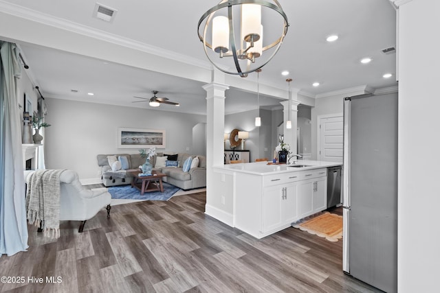 57 N Passerine Path, Hampstead, NC 28443 - kitchen featuring stainless steel appliances, a ceiling fan, recessed lighting, open floor plan, and light countertops