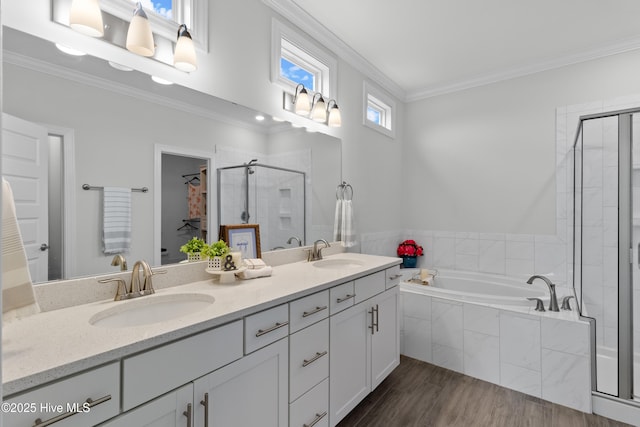 57 N Passerine Path, Hampstead, NC 28443 - full bath featuring a shower stall, double vanity, a bath, ornamental molding, and wood finished floors