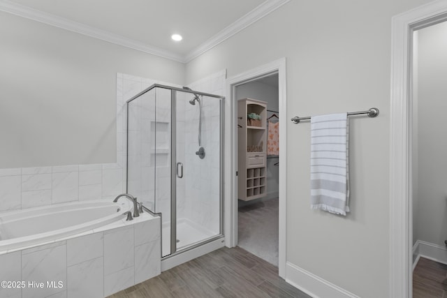 57 N Passerine Path, Hampstead, NC 28443 - full bath with a garden tub, a stall shower, a spacious closet, ornamental molding, and wood finished floors