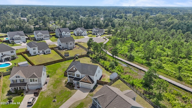 57 N Passerine Path, Hampstead, NC 28443 - aerial view of residential area with a heavily wooded area
