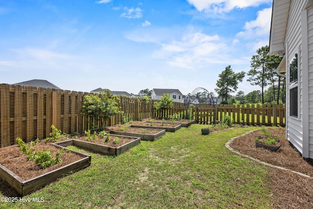 57 N Passerine Path, Hampstead, NC 28443 - fenced backyard with a vegetable garden