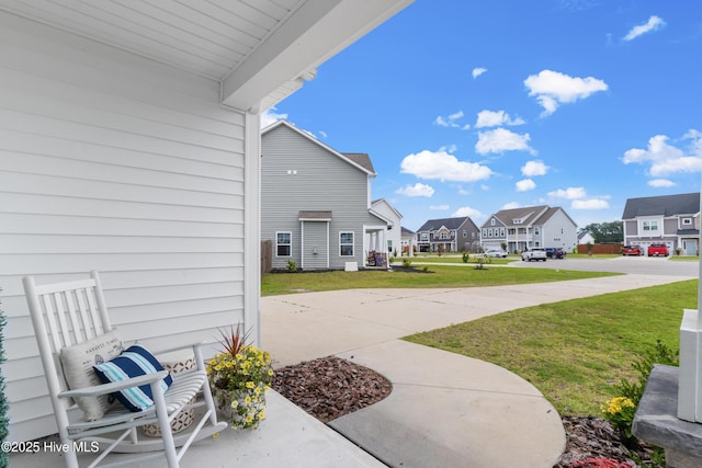 57 N Passerine Path, Hampstead, NC 28443 - view of patio / terrace featuring a residential view