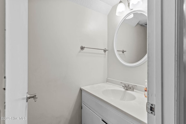 213 Spruce Ct, Jacksonville, NC 28546 - bathroom with vanity and a textured ceiling