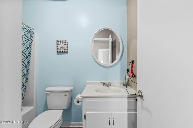 213 Spruce Ct, Jacksonville, NC 28546 - bathroom featuring vanity, toilet, and shower / tub combo with curtain