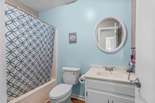 213 Spruce Ct, Jacksonville, NC 28546 - bathroom featuring vanity, toilet, shower / tub combo with curtain, and a textured ceiling