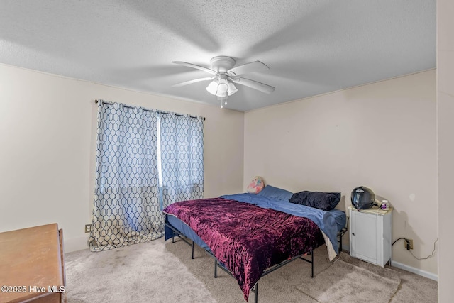 213 Spruce Ct, Jacksonville, NC 28546 - bedroom with carpet flooring, a textured ceiling, and a ceiling fan