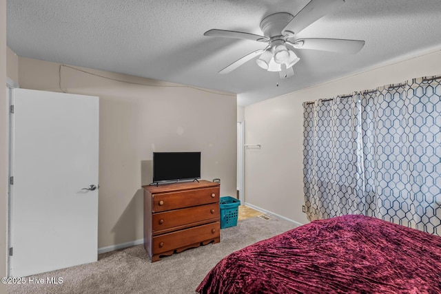 213 Spruce Ct, Jacksonville, NC 28546 - bedroom with light colored carpet, a textured ceiling, and ceiling fan